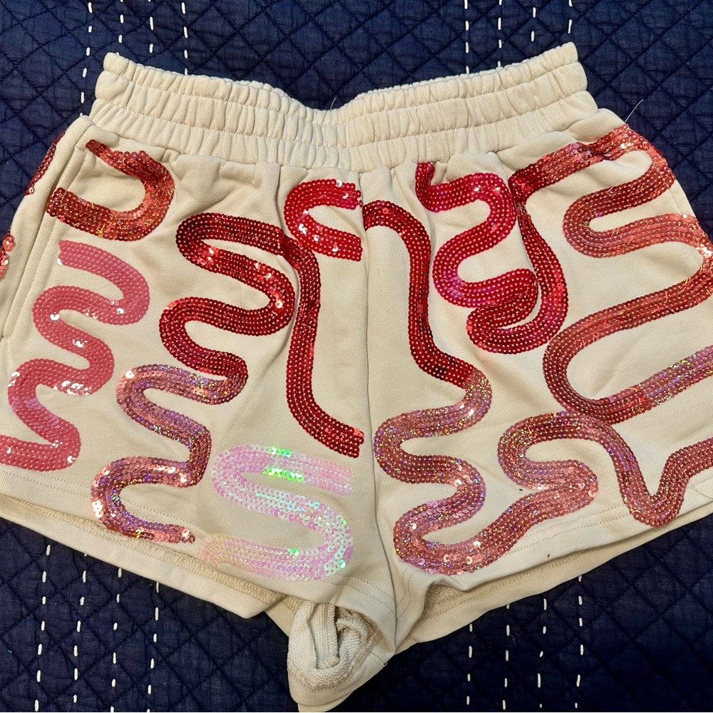QUEEN OF SPARKLES Cream Shorts with Red and Pink Sequins